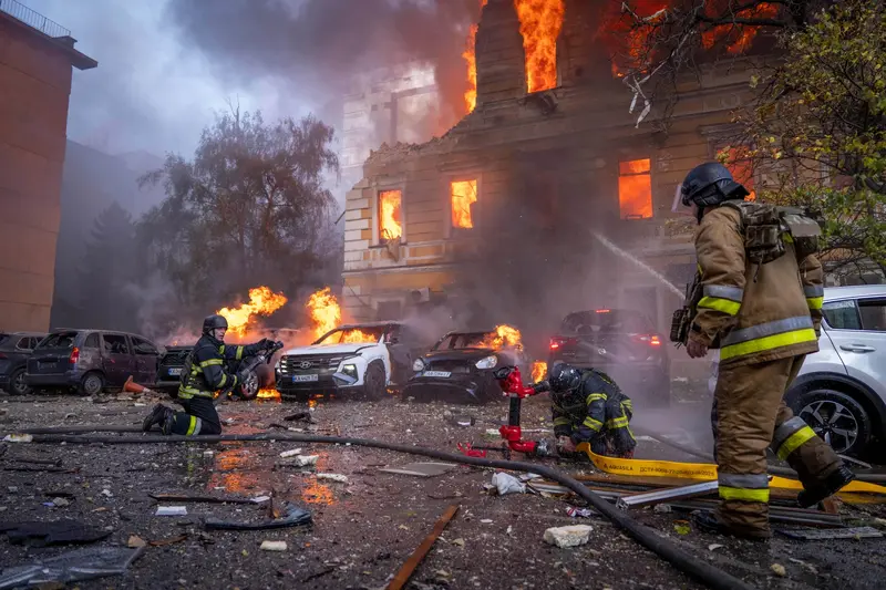 Emergency crews respond after a missile and drone attack in Kyiv